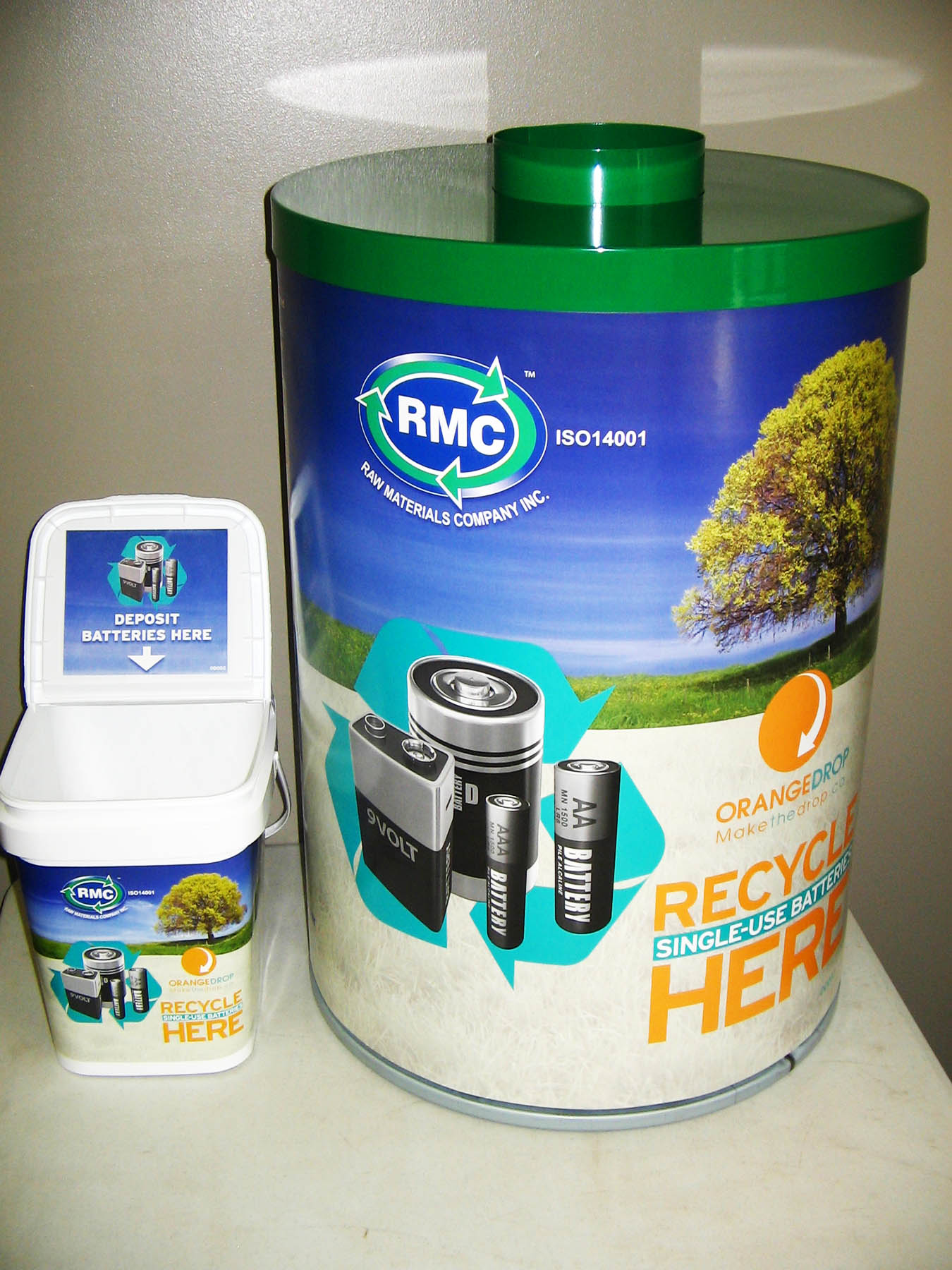 picture of two battery recycle bins