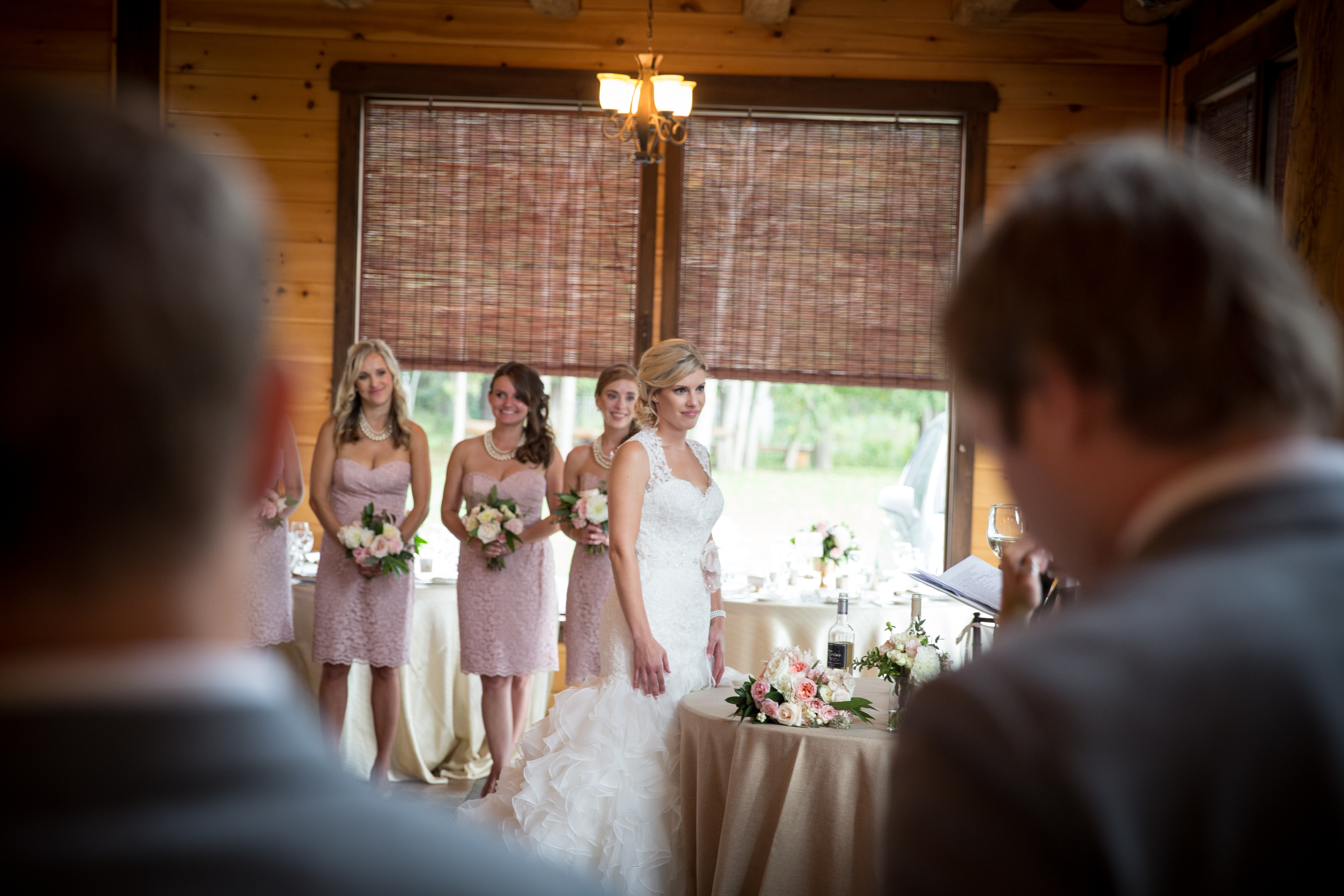 picture of bride standing at a table